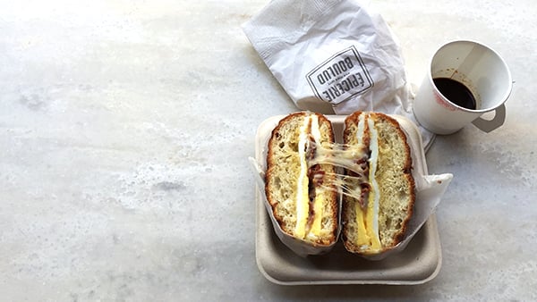 Egg sandwich with coffee cup from Epicerie Boulud