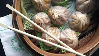 Bowl of dumplings and chopsticks from Joes Shanghai