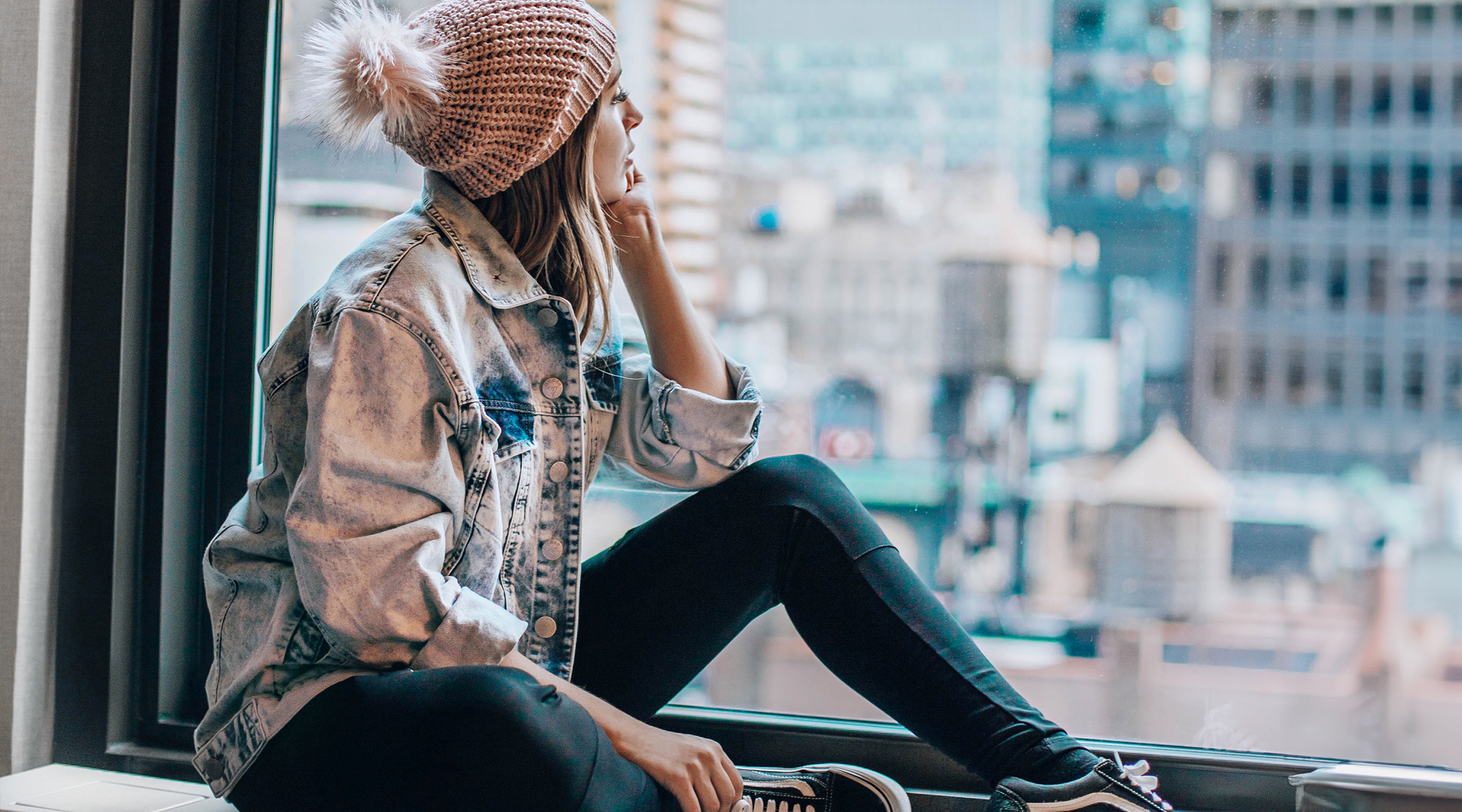 woman looking out window