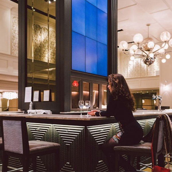 person sitting at Park Central bar