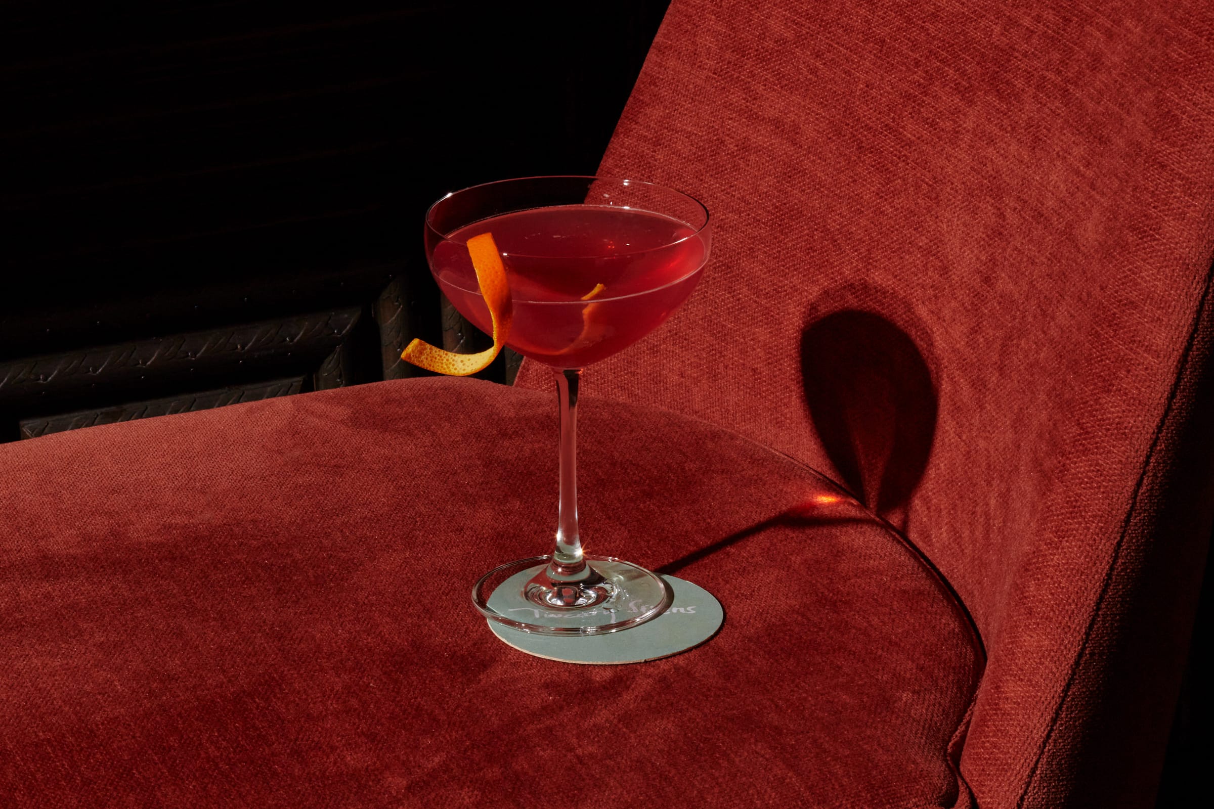 a cocktail on a red chair