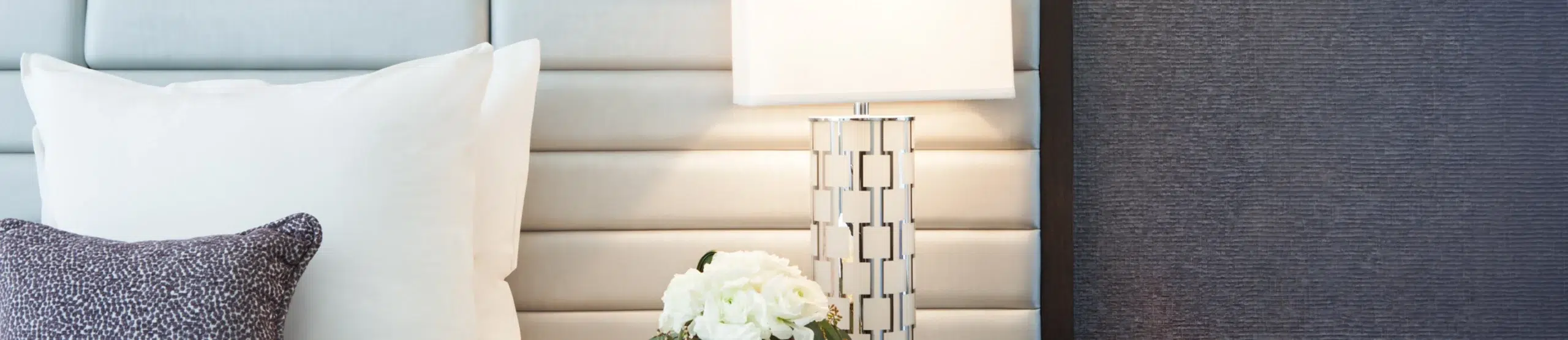 Classic Queen room detail with modern bedside lamp at Park Central Hotel