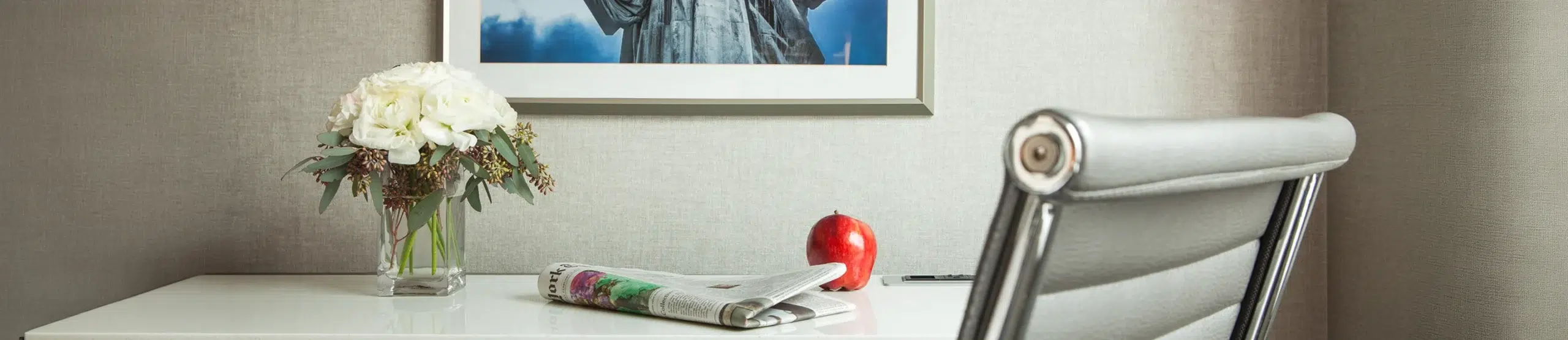 Classic room workspace with modern desk and New York-inspired artwork